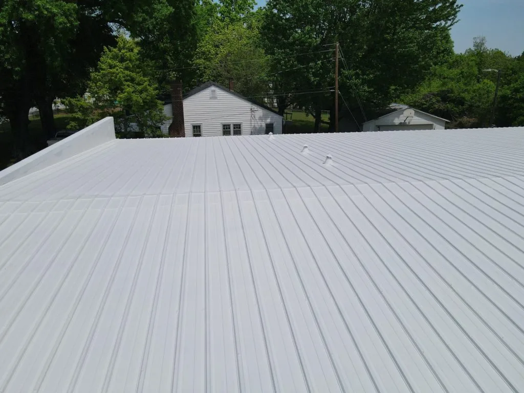 to show a white elastomeric roof coating