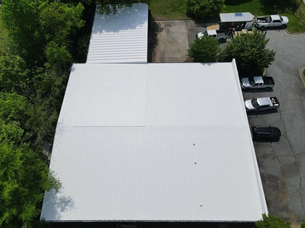 white elastomeric coating applied to a metal roof