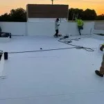 installation of a white thermoplastic polyolefin (TPO) single-ply roofing membrane