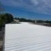 Newly installed white commercial roofing membrane