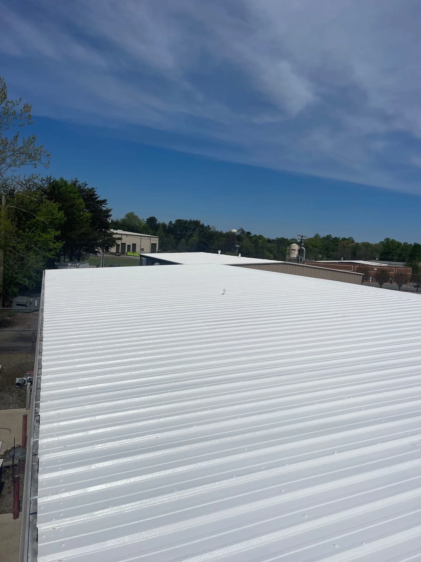 Newly installed white commercial roofing membrane