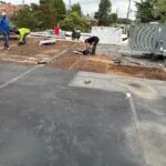 White commercial roof with waterproof membrane