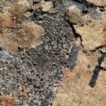 remnants of asbestos floor felt underlayment