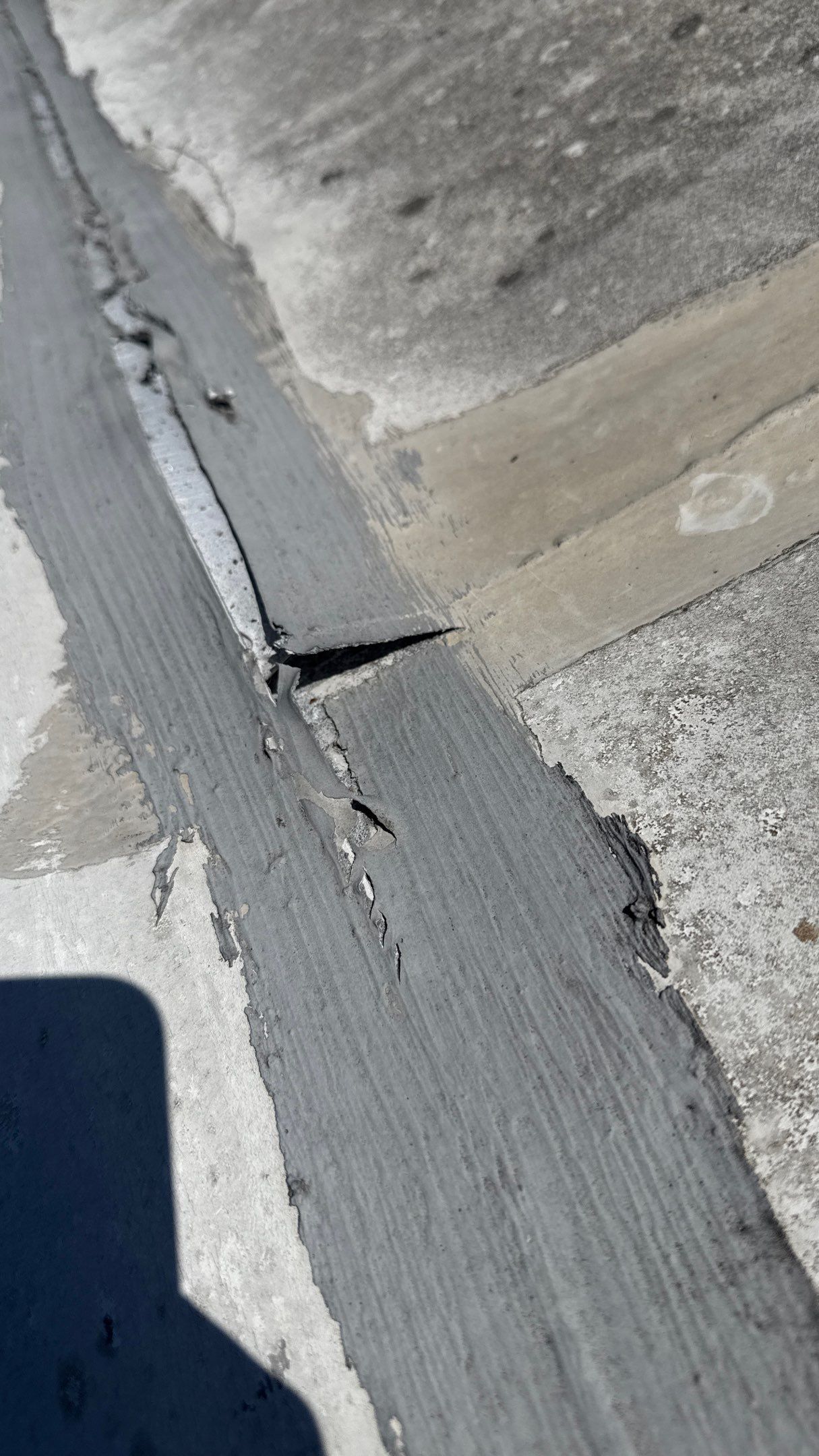 Failed EPDM seam separation on commercial roof