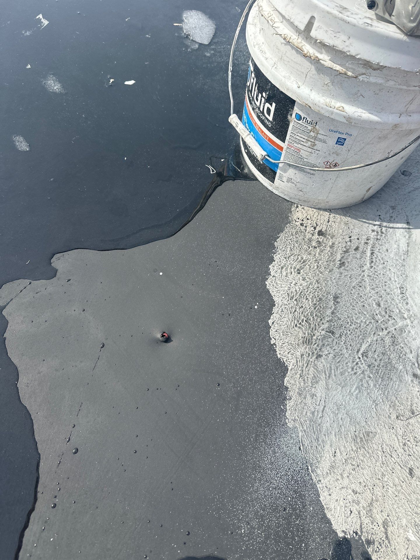 Fastener protruding through EPDM membrane