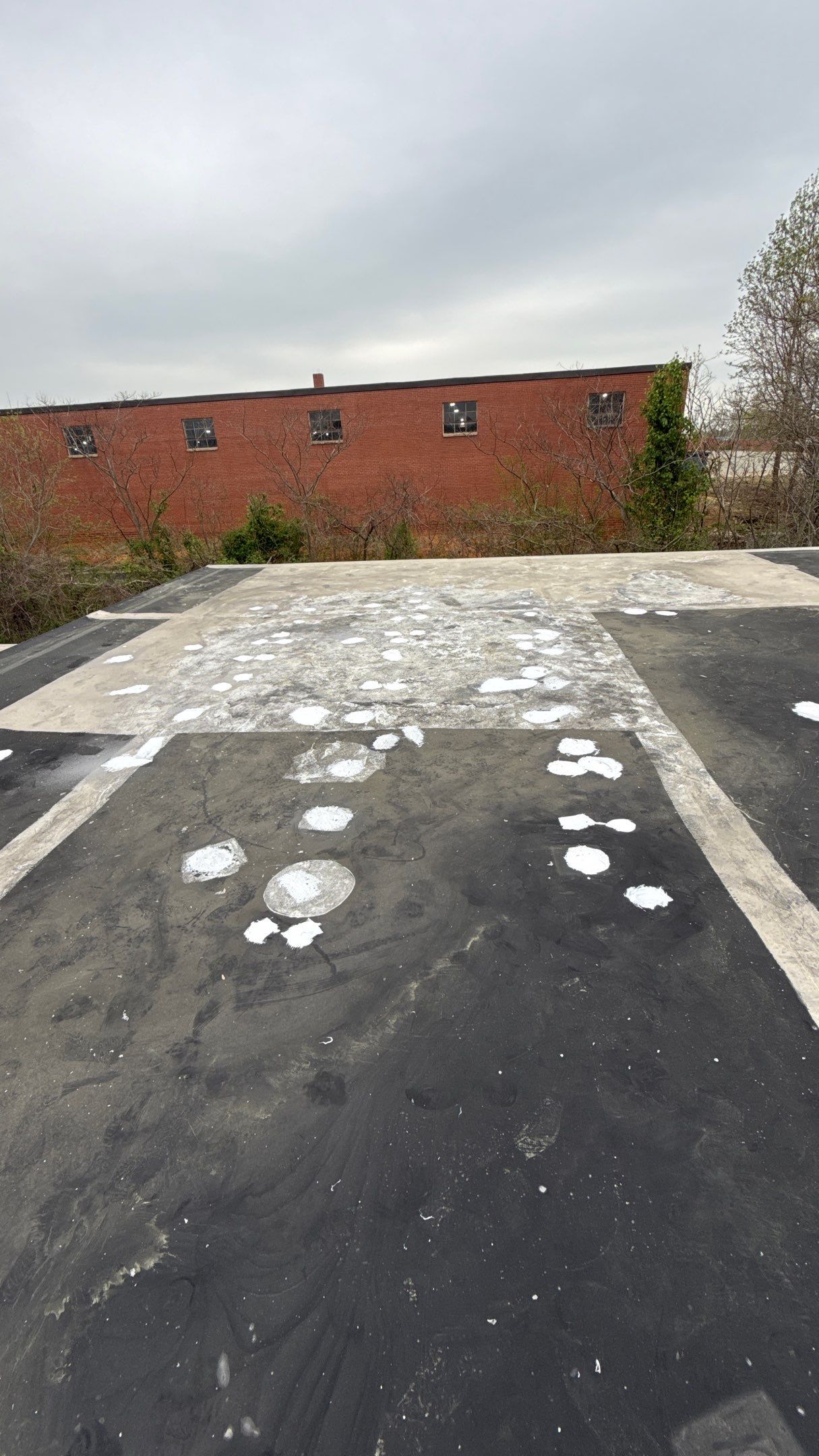 Multiple small patch repairs across roof surface