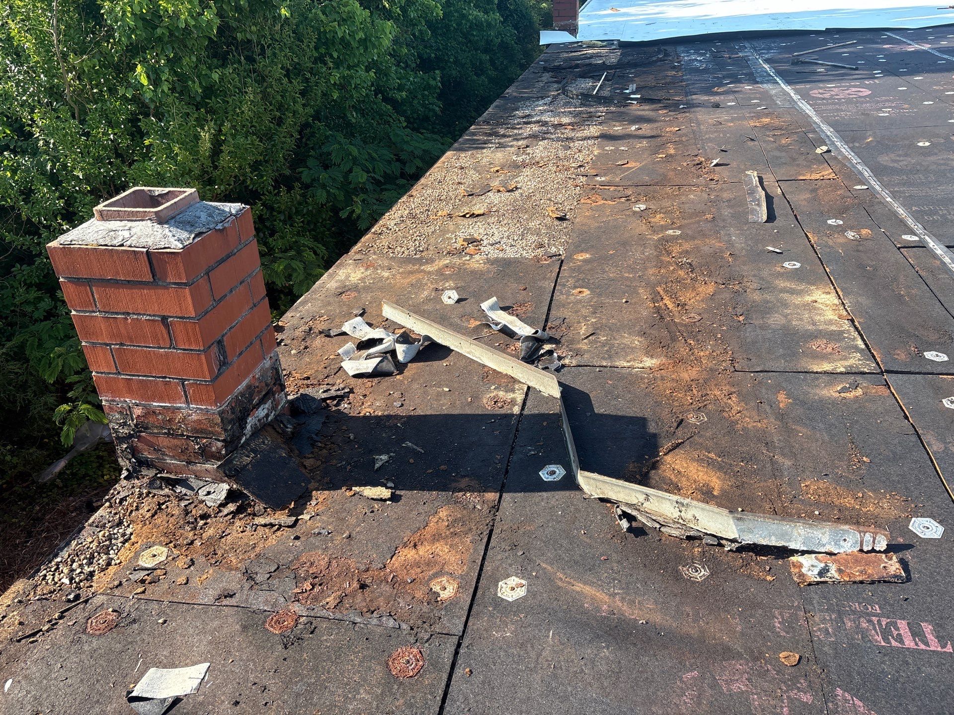 Commercial roof tear-off in progress in High Point