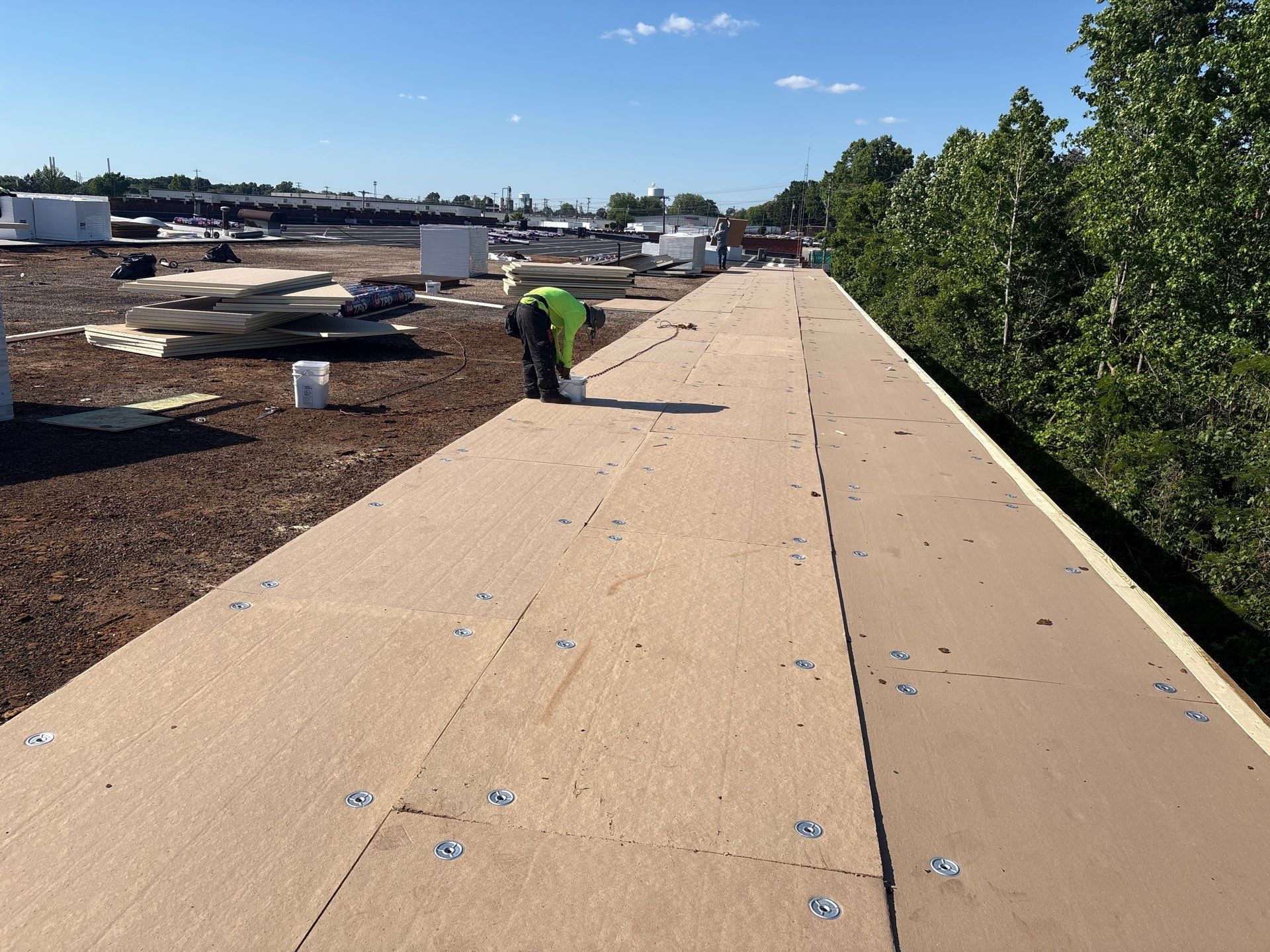 ISO board being installed on commercial roof deck