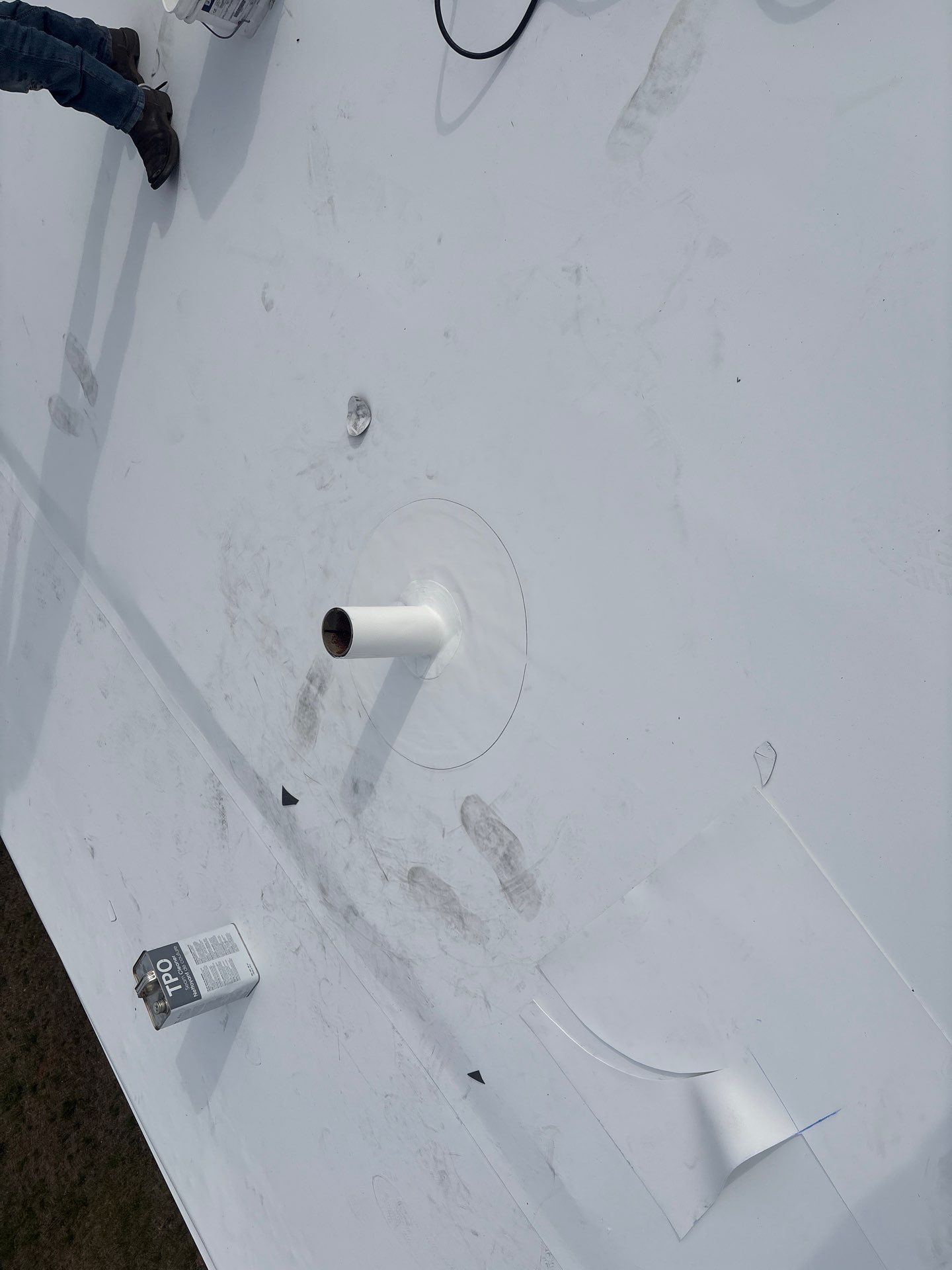 Completed pipe flashing detail on TPO roof