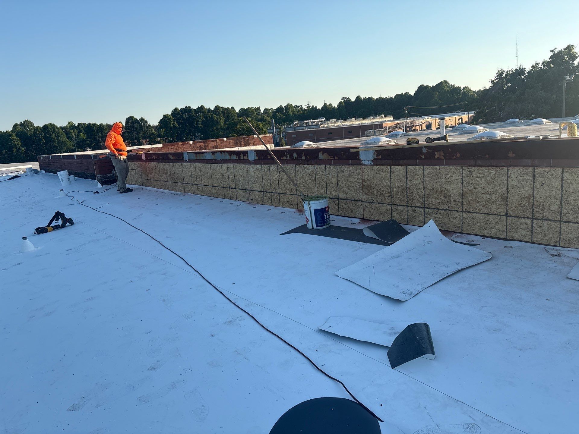 Plywood nailer attached to parapet wall
