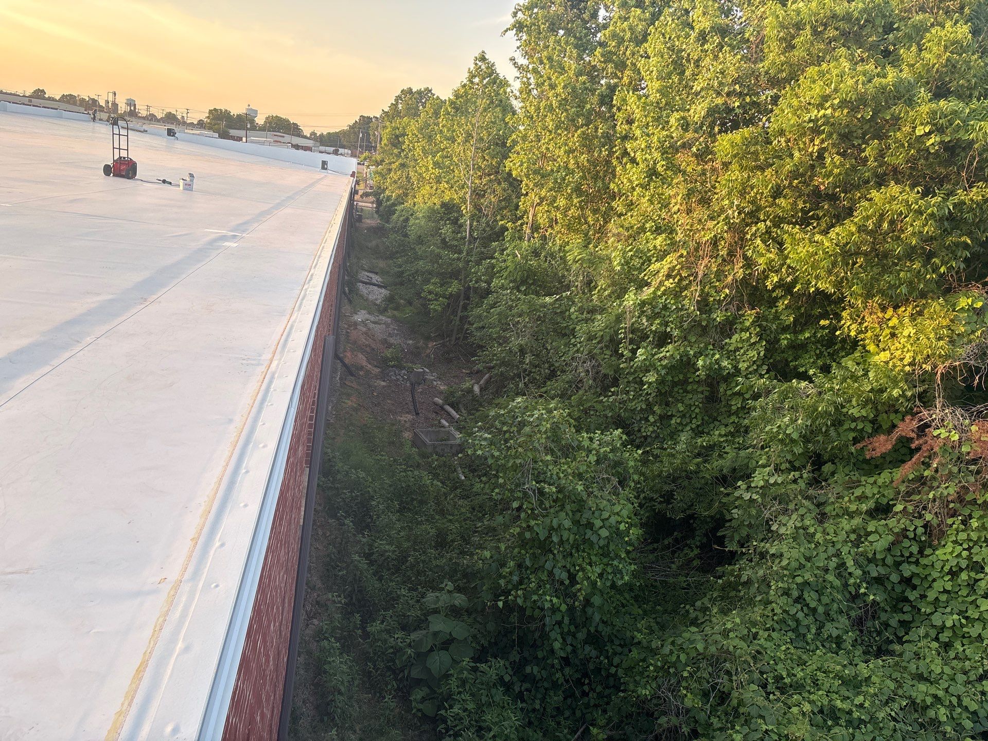 New white TPO roof with drip edge installed