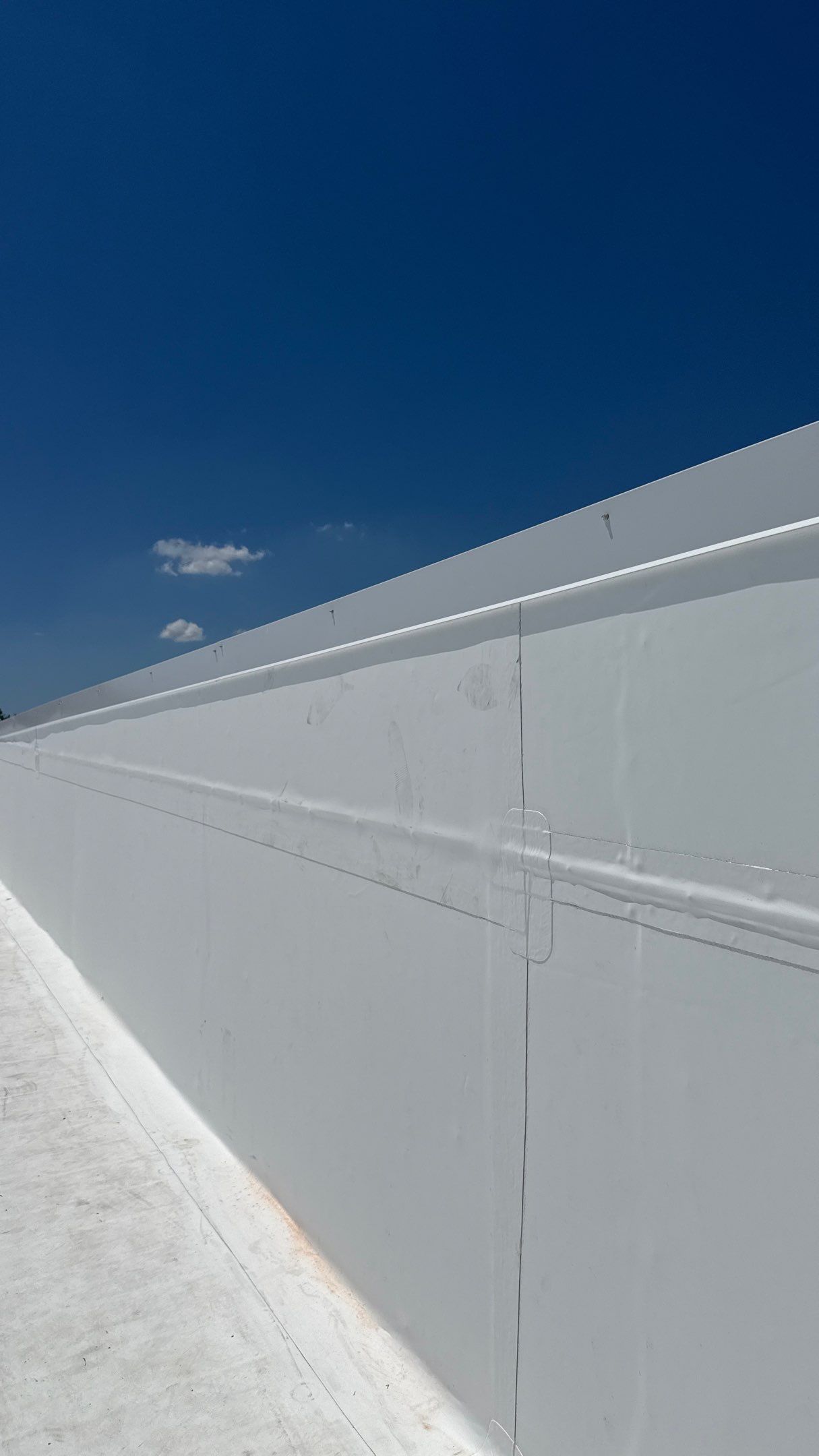 Finished parapet wall and metal coping trim