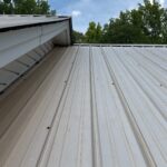 Technician performing commercial roofing on a commercial roof in Denton, NC