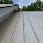 Technician performing commercial roofing on a commercial roof in Denton, NC