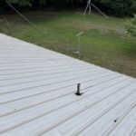 Technician performing commercial roofing on a commercial roof in Denton, NC