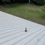 Technician performing commercial roofing on a commercial roof in Denton, NC