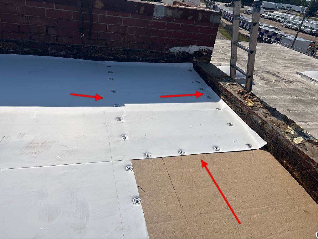 Technician performing commercial roofing on a commercial roof in High Point, NC