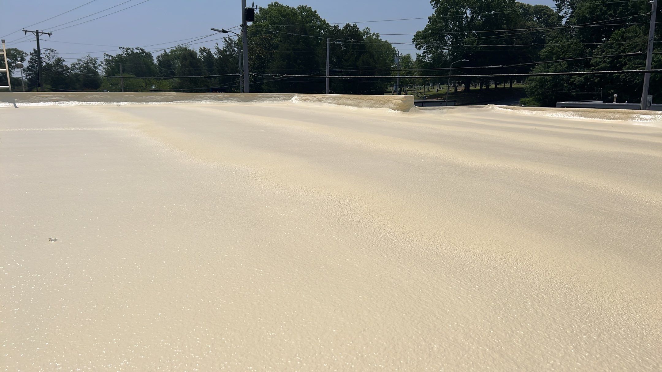 Technician performing commercial roofing on a commercial roof in Trinity, NC