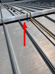 Technician performing commercial roofing on a commercial roof in Greensboro, NC