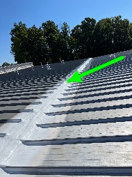 Technician performing commercial roofing on a commercial roof in Greensboro, NC