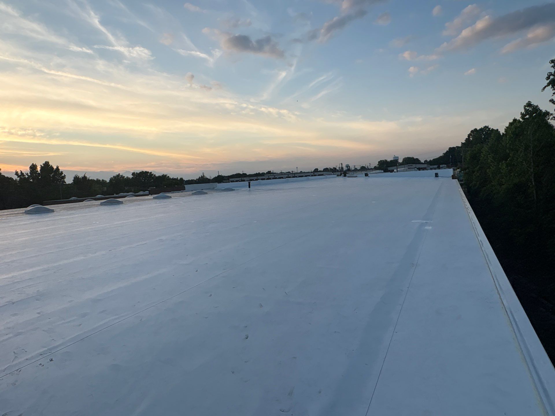 Technician performing tpo roofing on a commercial roof in High Point, NC