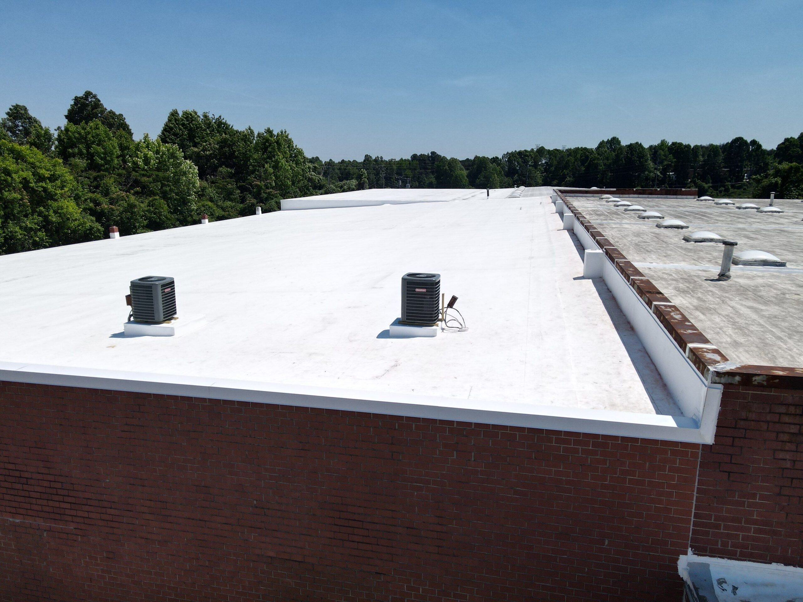 Technician performing tpo roofing on a commercial roof in High Point, NC
