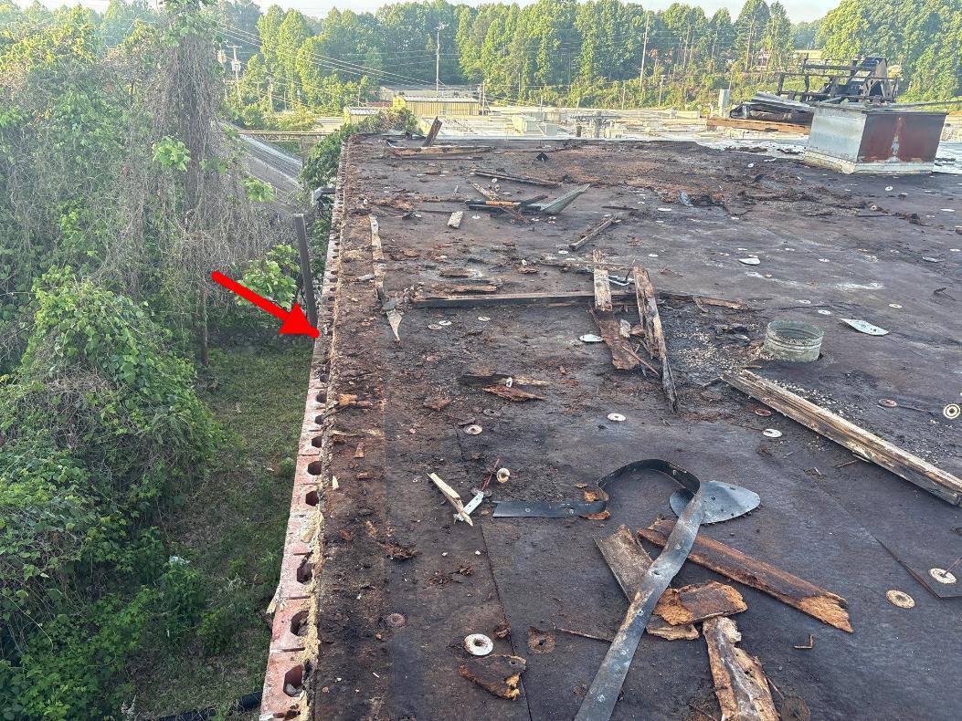 Technician performing tpo roofing on a commercial roof in High Point, NC