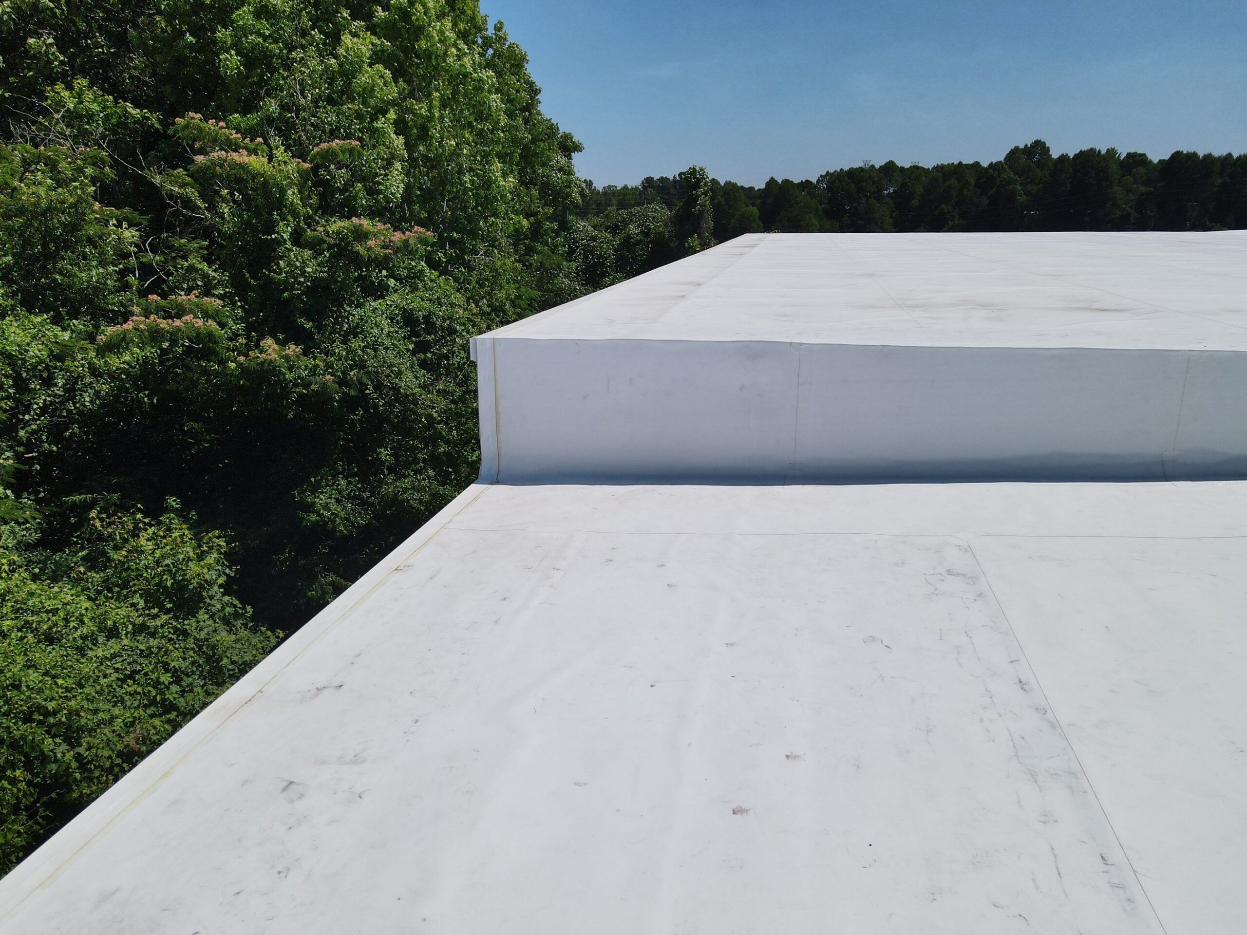 Technician performing tpo roofing on a commercial roof in High Point, NC